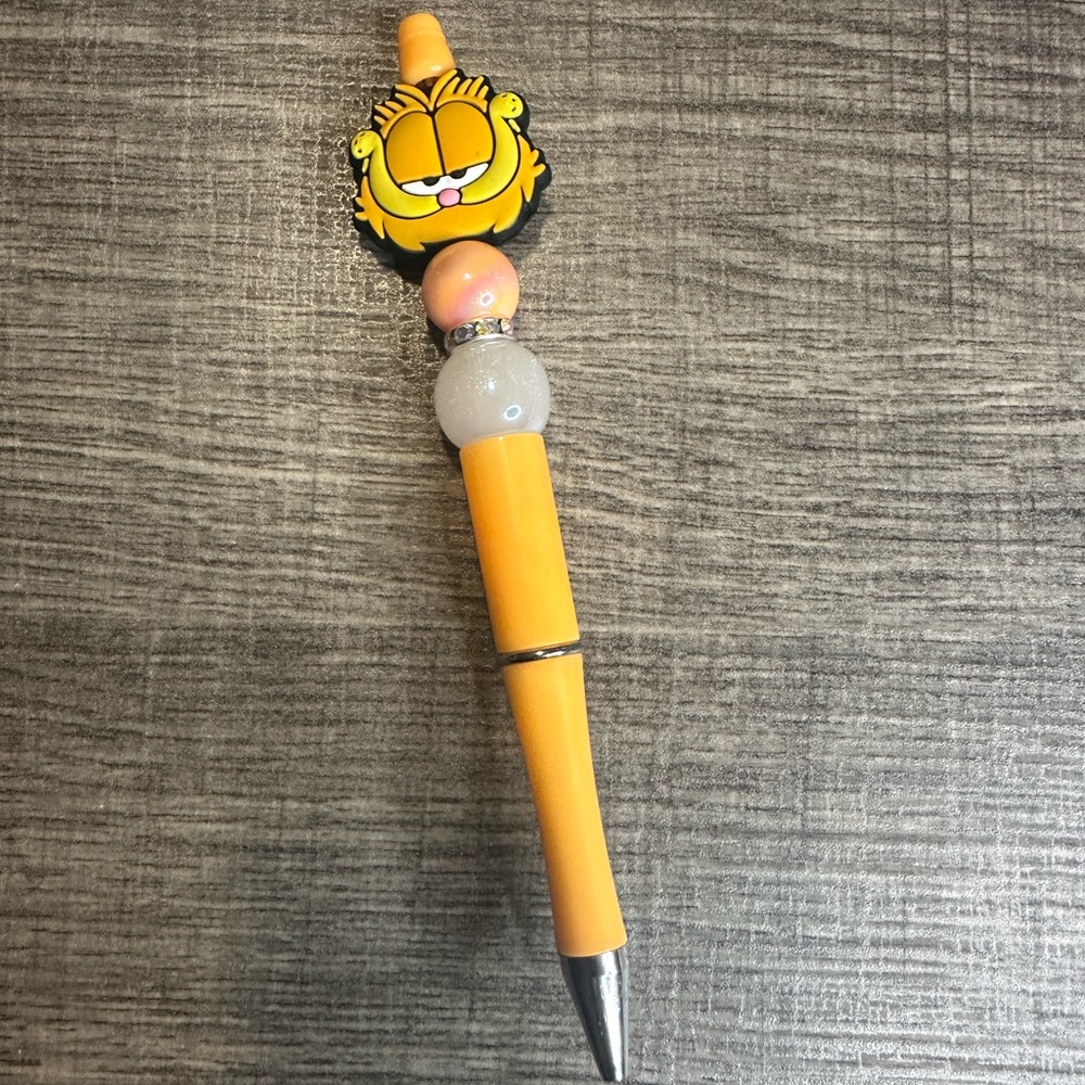 Yellow and Silver Cartoon Character Pen